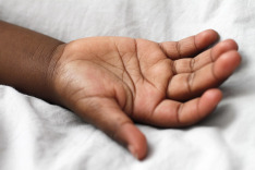 Dark skin kids had palm up